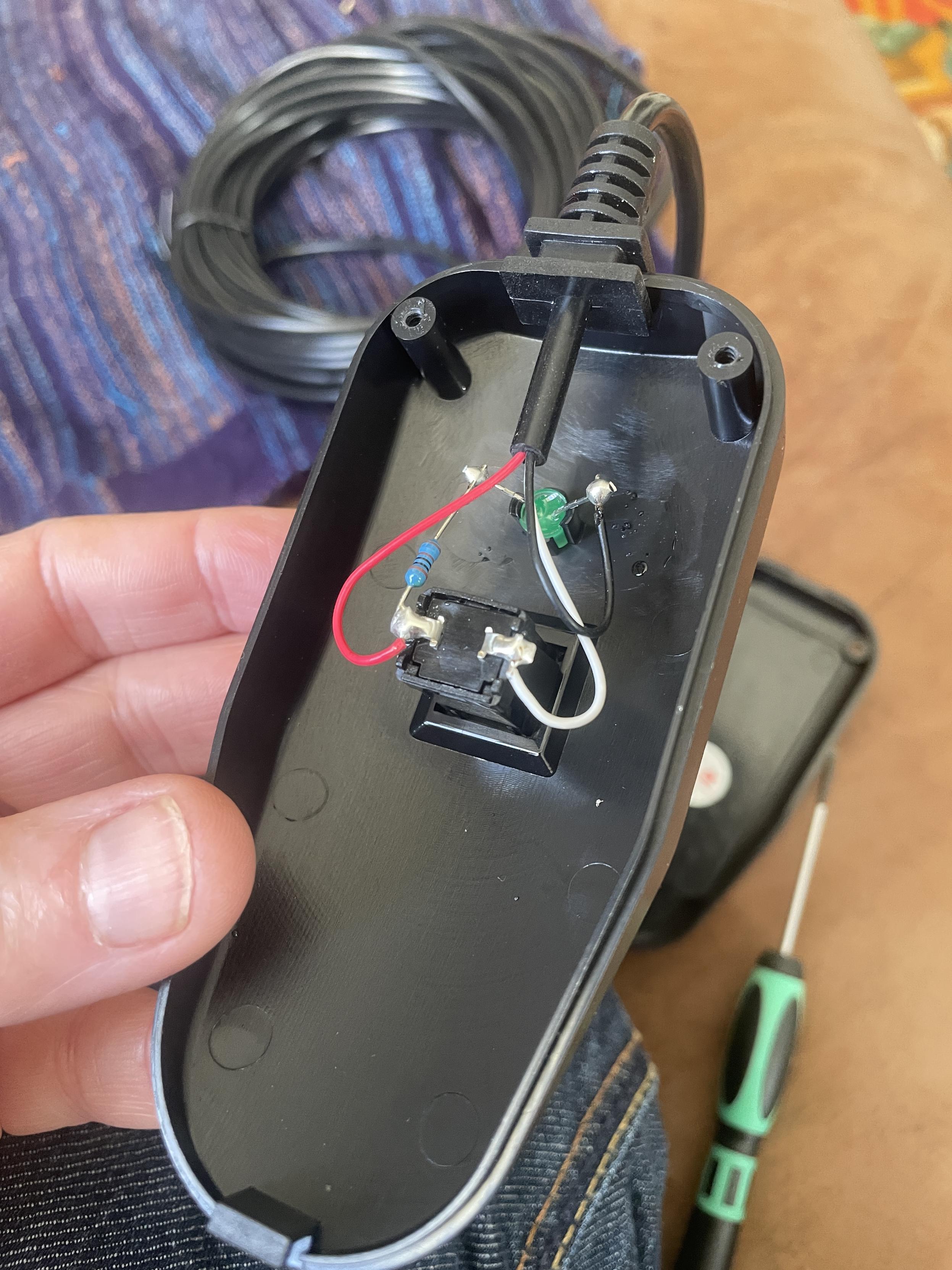 The innards of the button - 3 wires connecting an led and the button