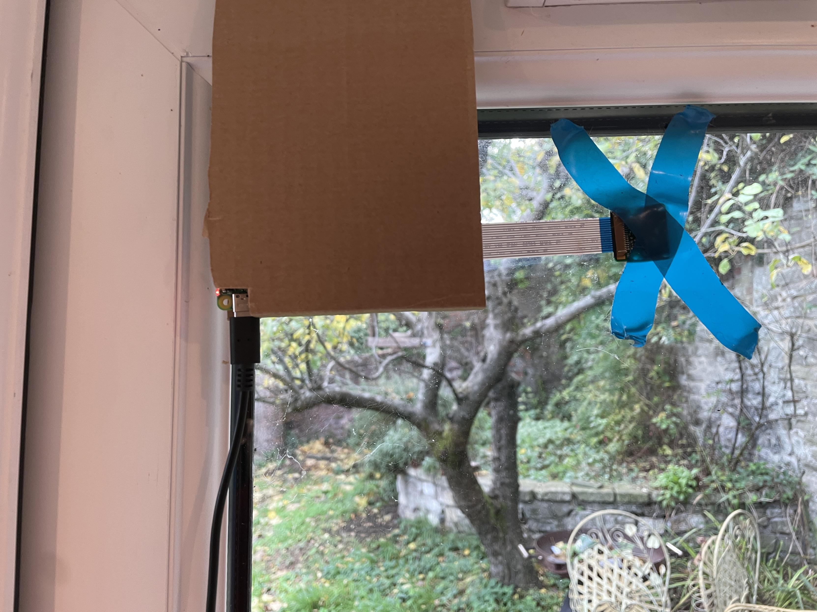 v1 camera holder short, jammed in the door, camera protroding out to the right - didn't work as the image was rotatated 90deg